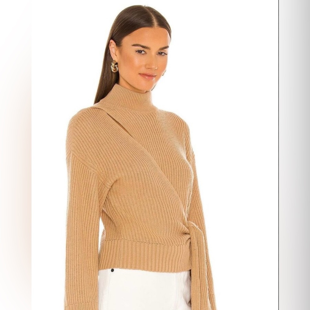 Wrap camel sweater with a 90s vibe. Slight bell sleeves. Hits at top of hip.
